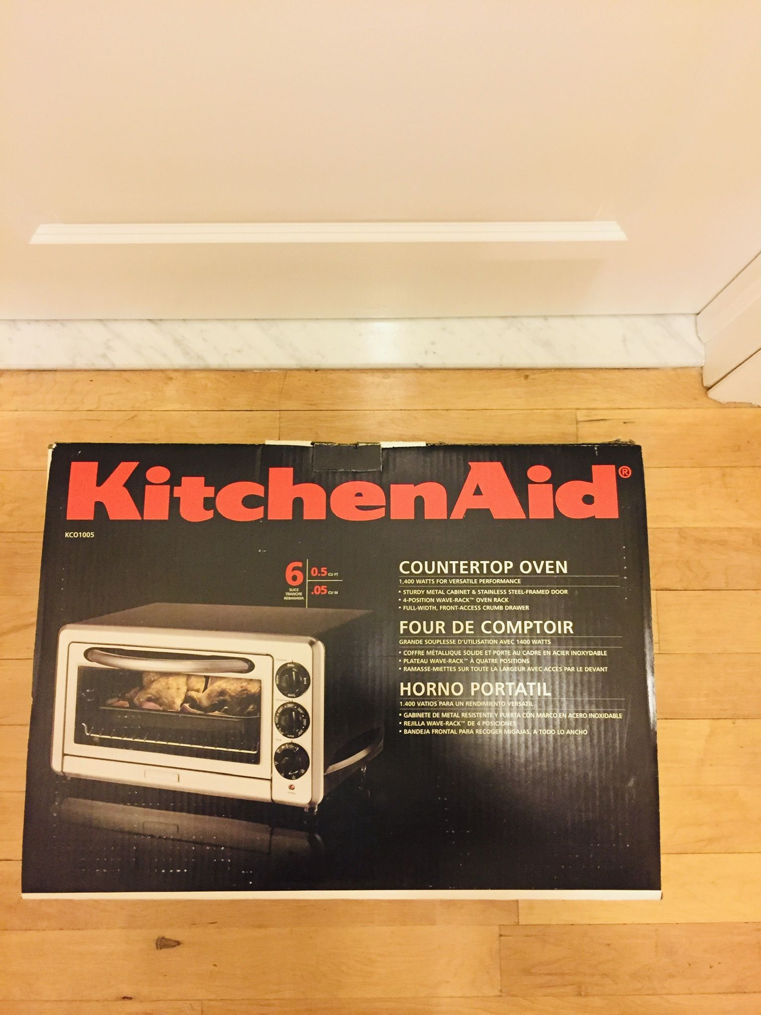 Famous Kitchen Aid countertop oven. Like new condition. Still in original box. 0.5 cu ft. 1400 watts. Bake, Broil, Toast, Warm. So powerful, so spacio