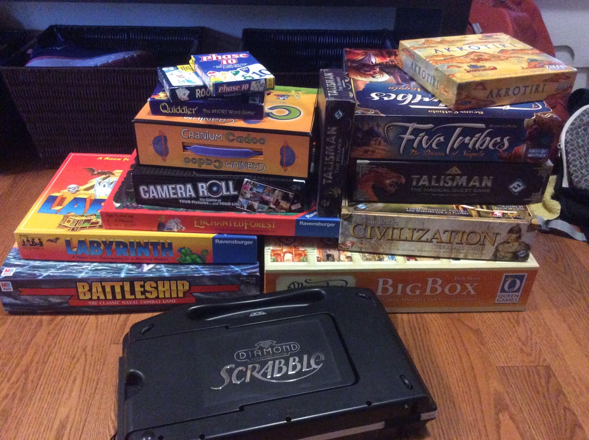 12 Family and euro style board games. Includes civilization,, five tribes, (talisman has been sold)