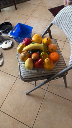 bundle of artificial fruits and cristal plate