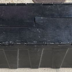 Black hard plastic attached lid tool container for truck or car. Made by Orbis USA. 39" long x 14" wide x 12" tall