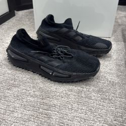 adidas NMD_S1 sneakers, specifically the black colorway such as model FZ6381. 