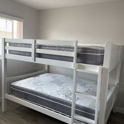 Full over Full bunk bed. Dark walnut,grey & white-$499. Full mattresses -$125.00 each. Assembly not included. Taxes included. Free delivery.  Se habla