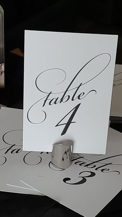 NIB card holders and 1-24 place cards in both cream and silver