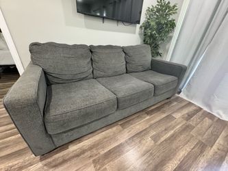 Charcoal grey sofa. Fabric in excellent condition.