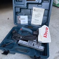 Bosch 1594K 3-1/4 inch planer with its carrying case.