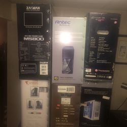 7 computer cases a bunch of laptops for parts couple motherboards and laptop screens