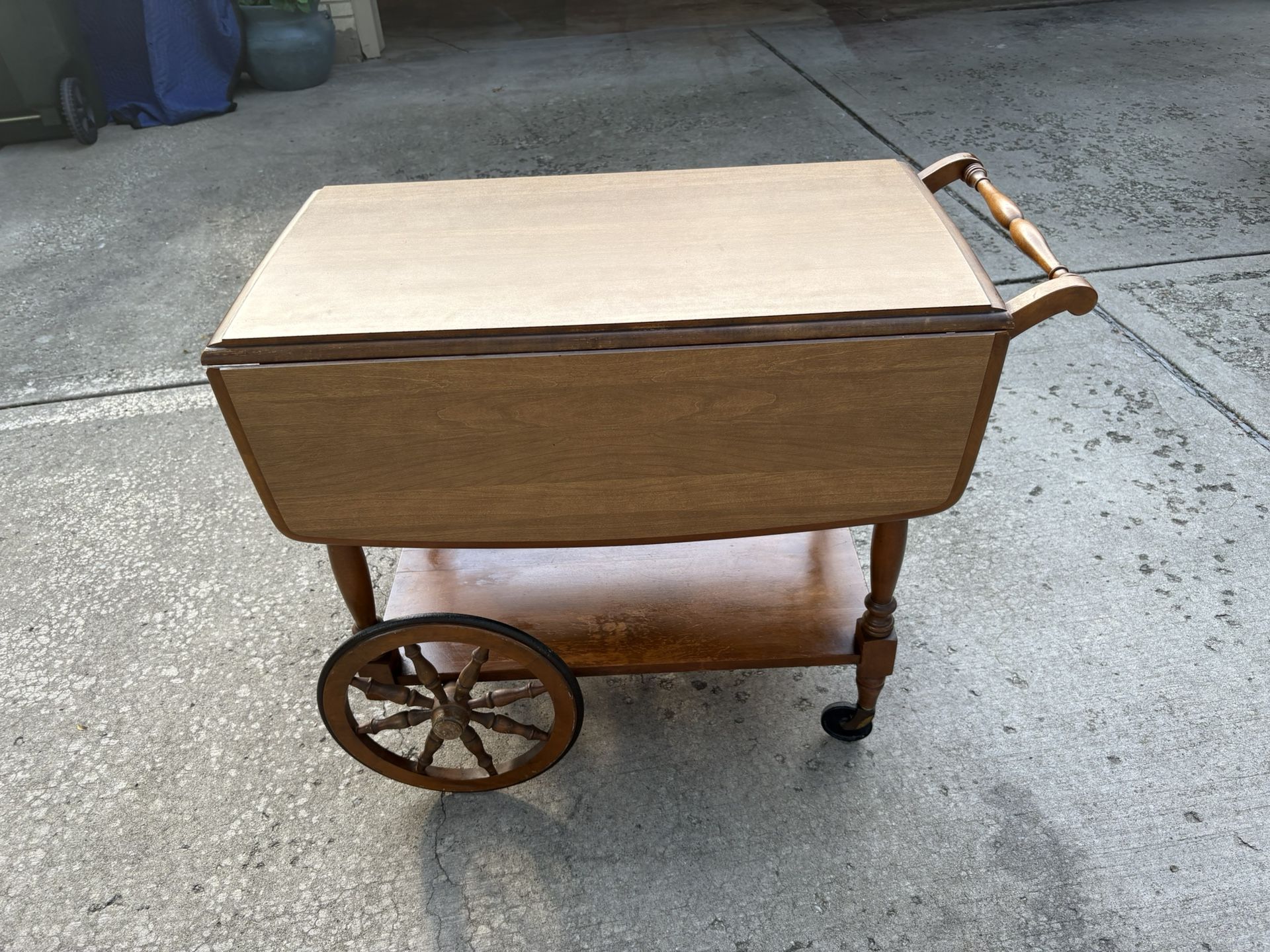 Vintage Rockport Maple tea cart bar cart on wheels w/ drop down leaf sides bottom shelf & 1 storage drawer. Excellent condition.