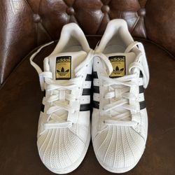 White Adidas Superstar Shoes With Black Stripes
