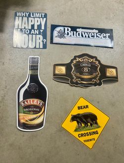 Various new & used metal bar signs.