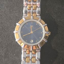 Lucien Piccard two-tone (gold and silver) ladies' watch with a blue analog dial and date calendar function. 