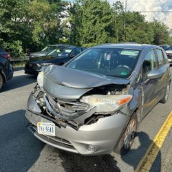 Selling my 2015 Nissan Versa with front-end damage from a recent accident The car starts and moves, but will need major body repair.   