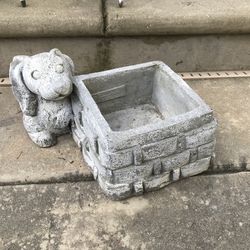A very cute vintage cement rabbit planter
