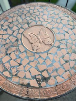 Terra-cotta and wrought iron butterfly outdoor bistro table