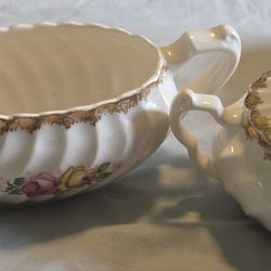 vintage pieces are a creamer and lidded sugar bowl from the Royal China Company in the Quban Royal pattern, featuring ribbed porcelain with pink and y