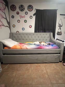 Twin bed with grey bed frame