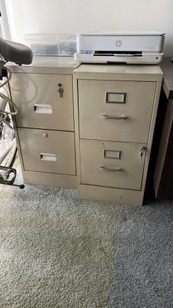 Two metal two drawer filing cabinets
