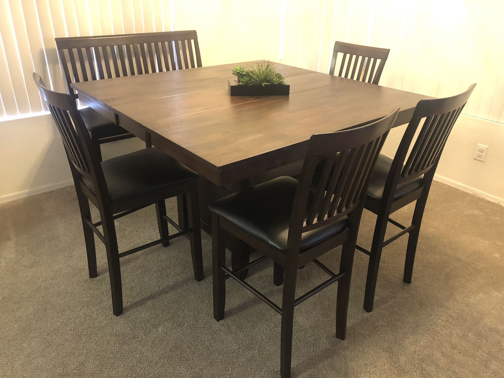 Pub height dining table and 6 leather padded chairs, delivery available