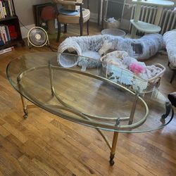 vintage glass coffee table with gold accents 