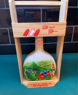 Collectible Pisco Peru handmade pottery bottle with wood stand