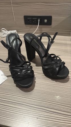 Black strap on open toe heels