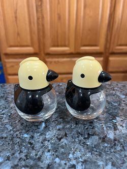 Vintage Stoha Germany Penguin Pair of Salt and Pepper Shakers.  The bottom Is glass.  Size approximately 3 inches tall.  Brand new never used.