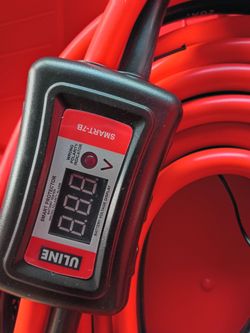 Jumper cables with inline voltage meter
