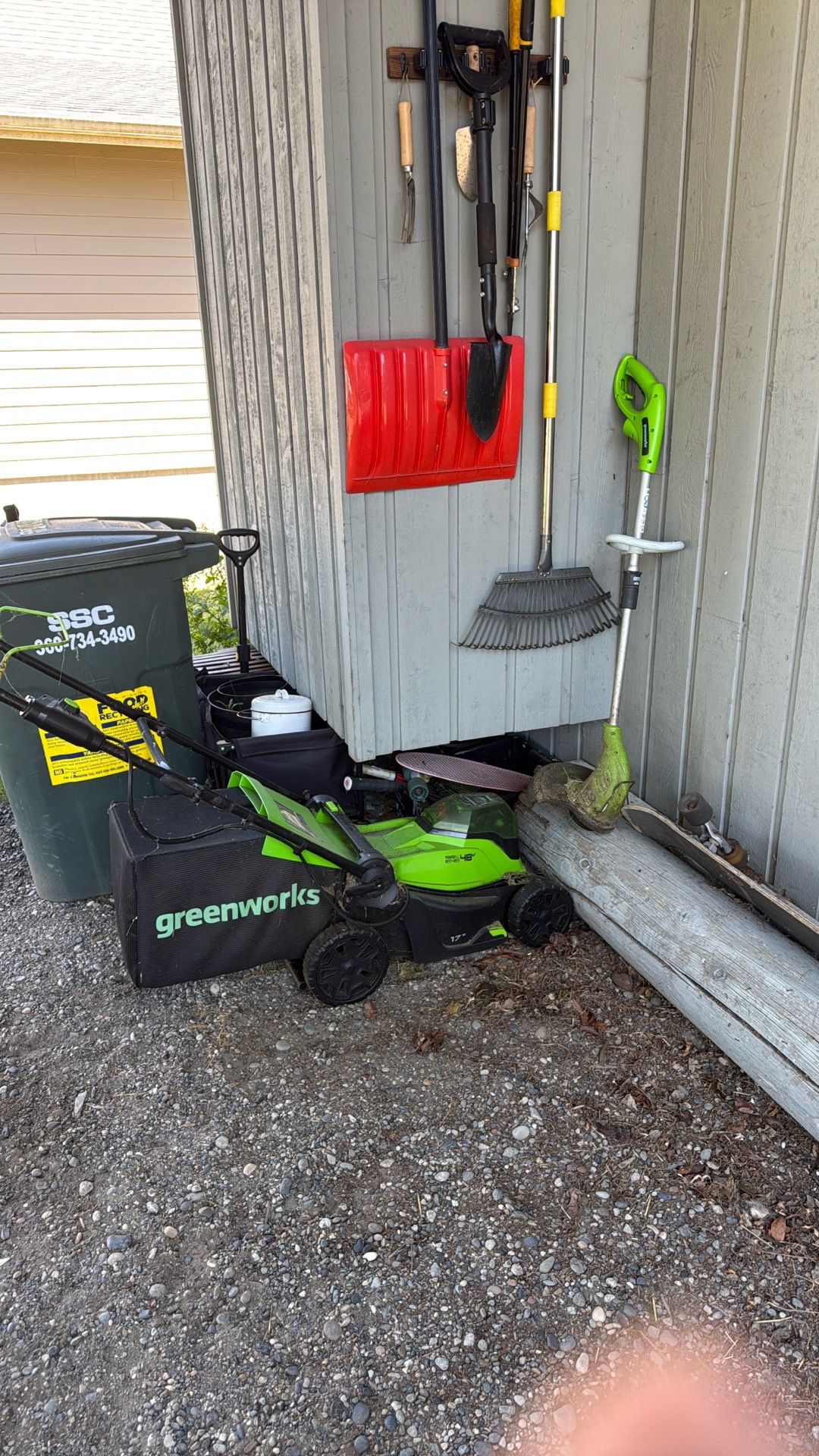 Green works lawn mower and weed wacker