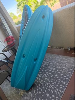 Two youth Kayaks one set of Ores