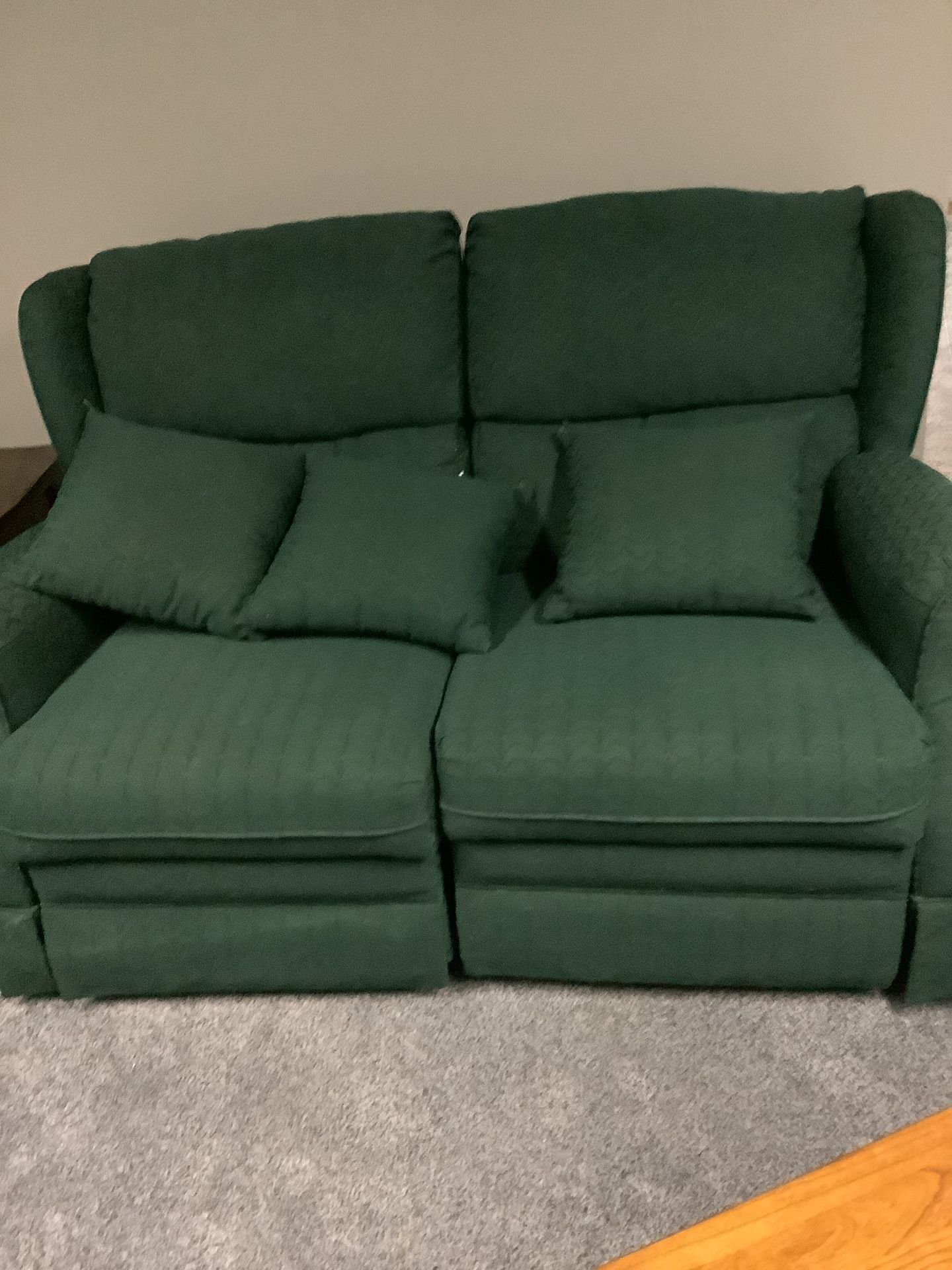Green Loveseat Which Both Recline With 3 Pillows