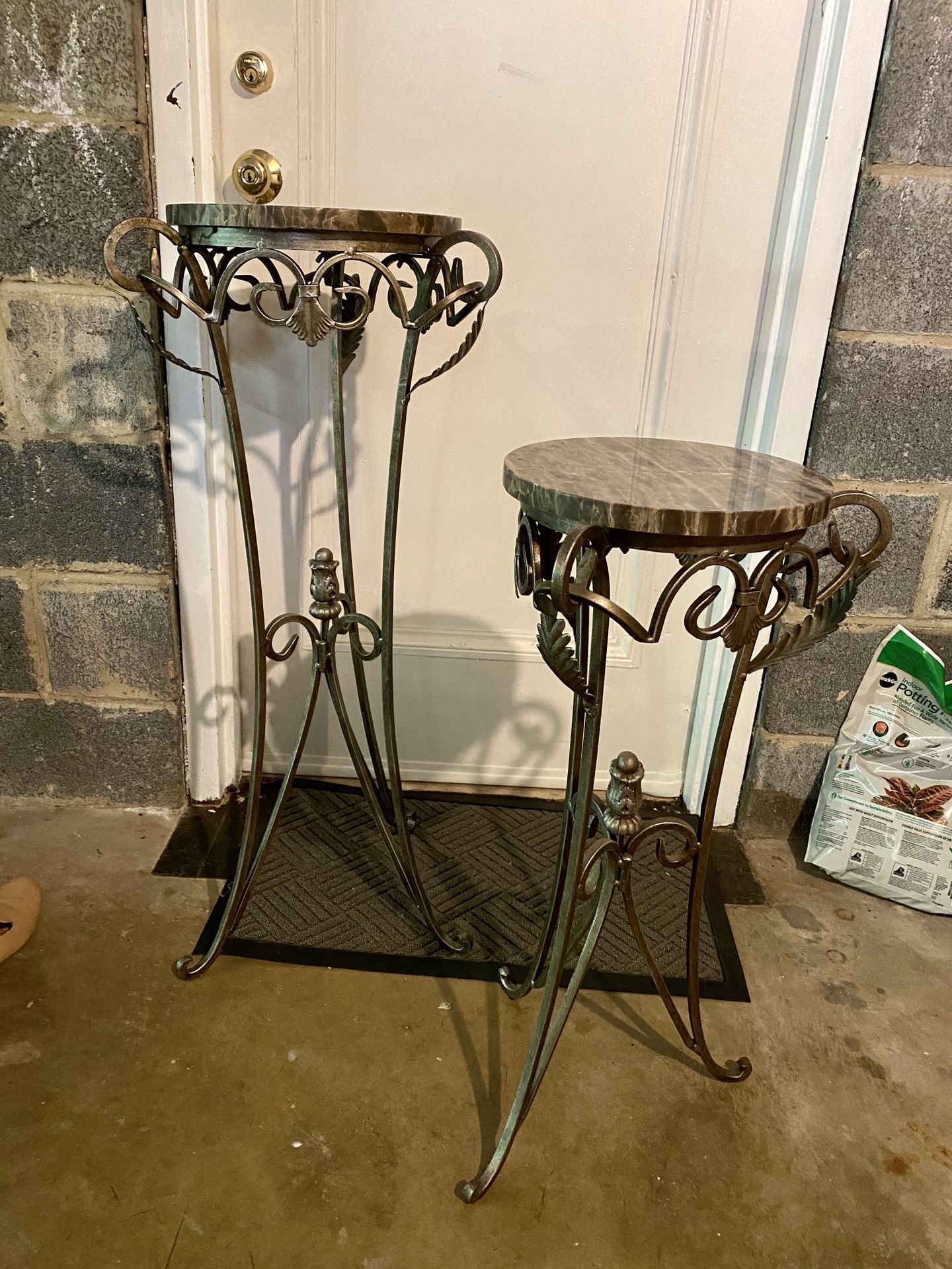 2 iron plant stands with marble tops