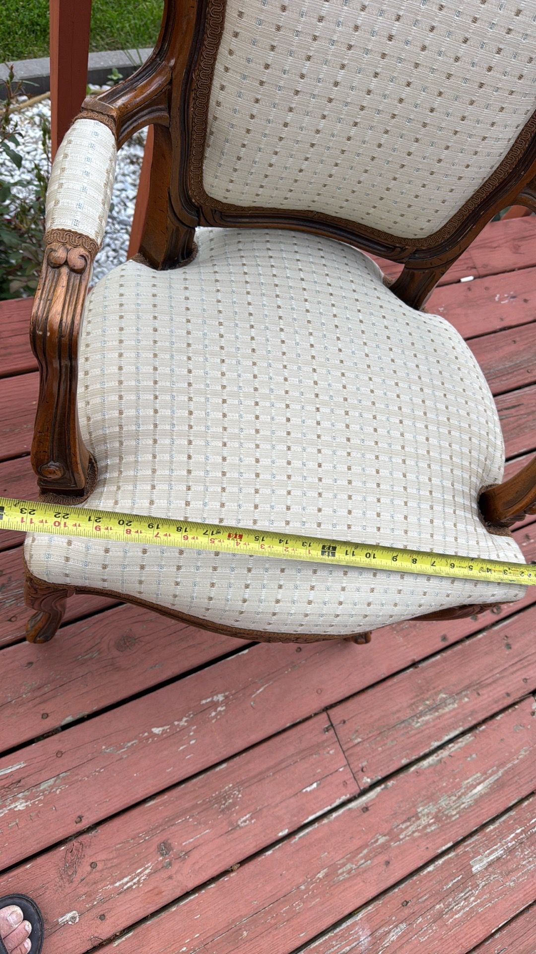 Gilberd’s tan/dark wood armchair