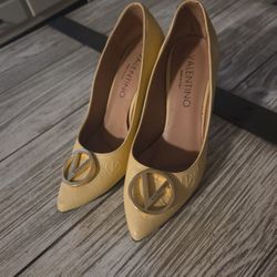 Valentino. Woman high hills.