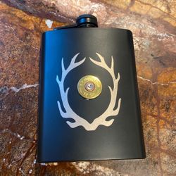 Remington 12 gauge in the center flask stainless steel 8 ounce