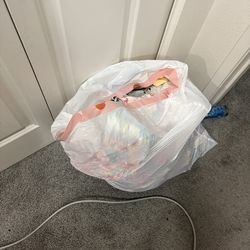 Trash bag full of 18-24 month girl clothes