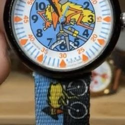 vintage 1996 Flik Flak "Bike" child's watch (model FFB 340) featuring bicyclists on the dial and strap