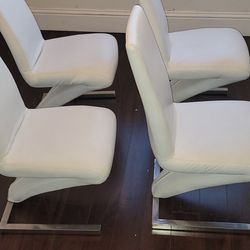 Four White Faux Leather Dining Chairs