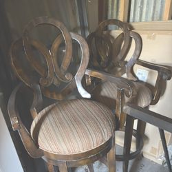 Pair of swivel bar chairs