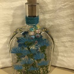 Blue Flowers Painted On Win Bottle.