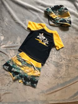 Yellow and blue swimming set with turtle design includes matching hat, size: 6 months,  $15 cash only. Cross Posted