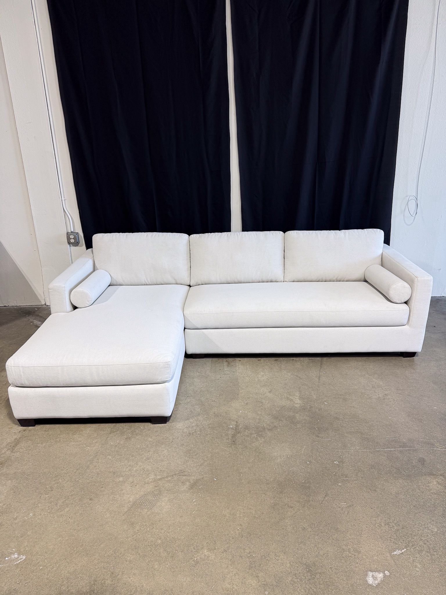 Abbyson.com Furniture • Mid-century Inspired Chaise Sectional with Cylindrical Bolster Pillows (Beige)