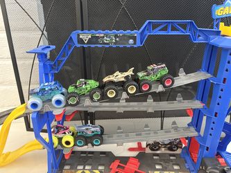 Monster Jam playset with 6 trucks. Works. My kids have outgrown it.