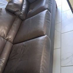 Brown Couch Has Tear 