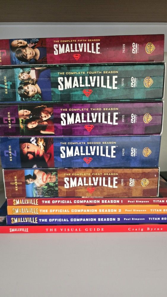 Smallville S1-S5 DVDs, plus 4 Companion Books Like New