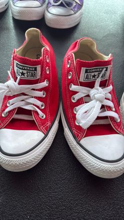 Converse Chuck Taylor All Star low-top shoes in a vibrant red canvas