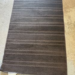 Brown material Shower curtain  and Rug
