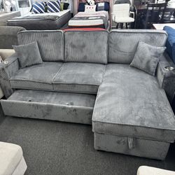 New Dark Gray Reversible Sectional W/ Cup Holder