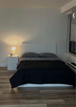 Full size bed with a mattress