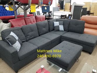 New in stock black gray linen sectional with pillows and storage ottoman