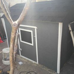 Outdoor wooden storage shed, 4' x 6'