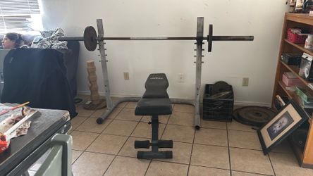 Bench press, dumbbells, and weights
